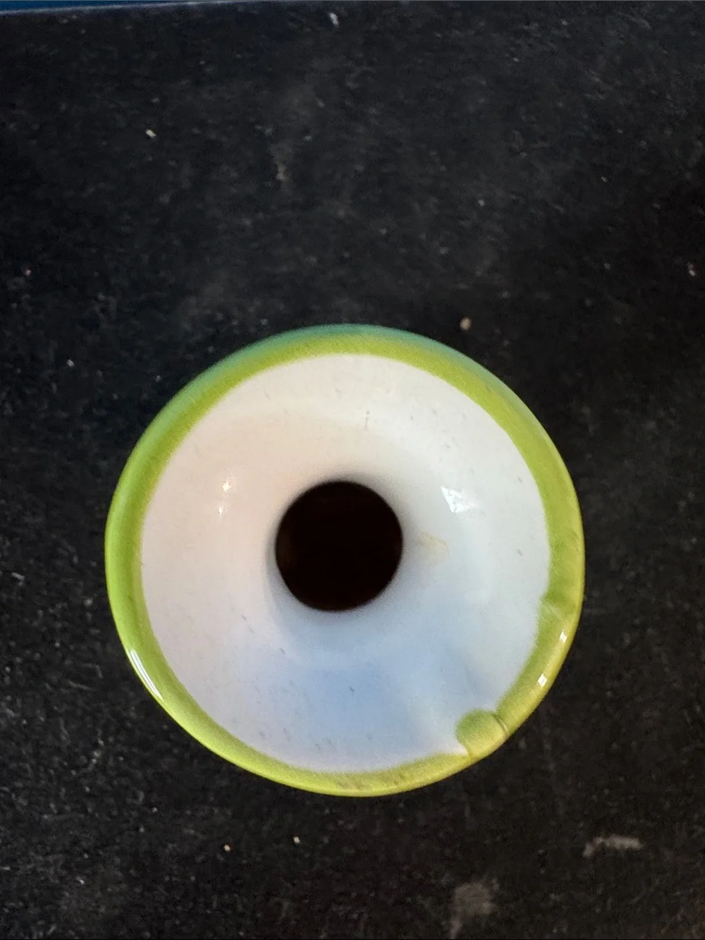 vintage ceramic vase features hand-painted floral motifs typical of mid-century